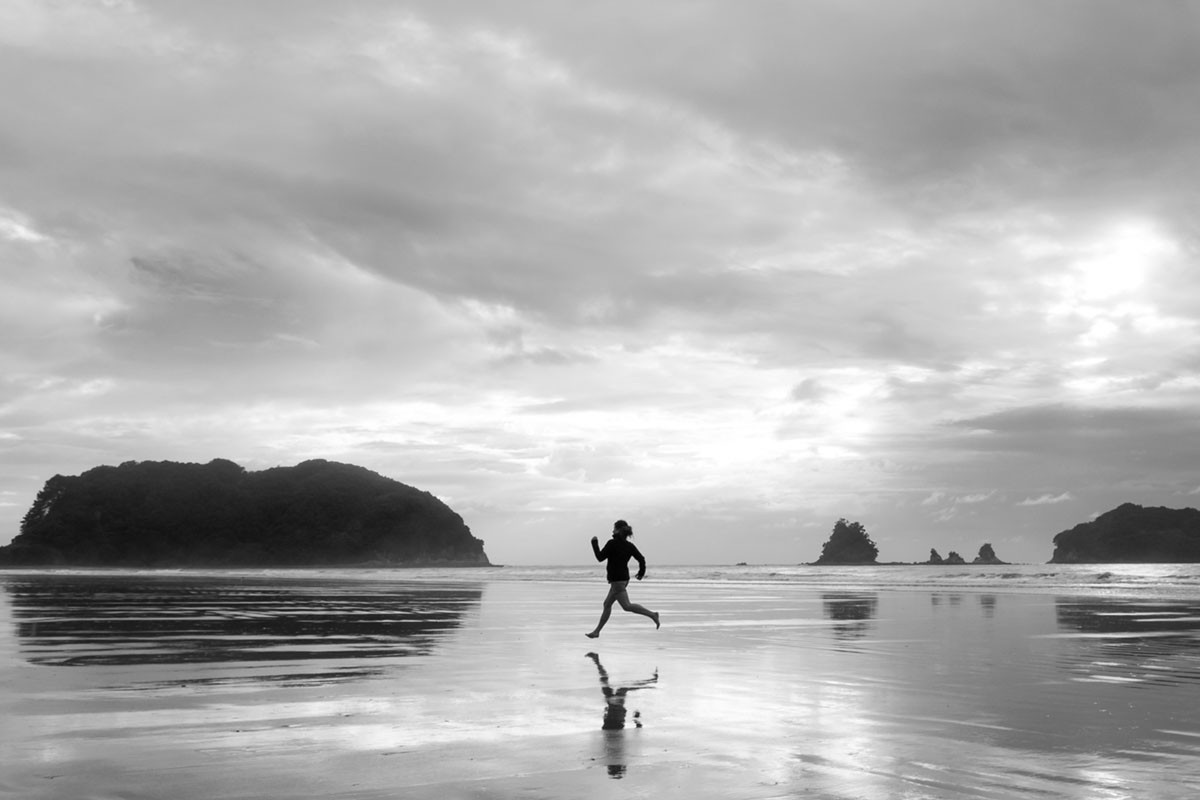 Person running on a beach